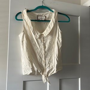 Anthroplogie sleeveless top with knot at bottom. Button up.
